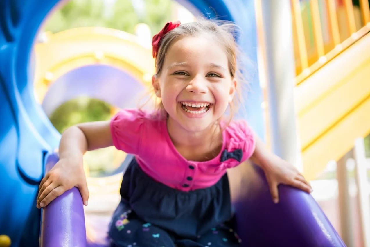 Happy child enjoying a gentle pediatric dental visit at Cy Becker Dental